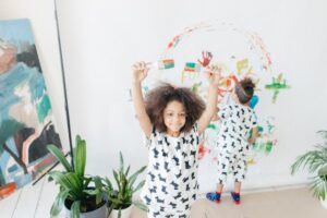 Kids painting a wall